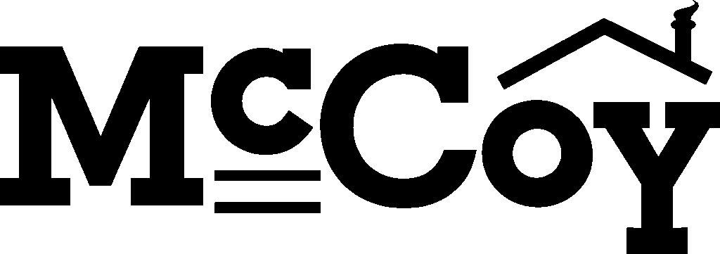 The word “McCoy” in bold black letters; the letter "y" is stylized with a roof and chimney graphic above it.